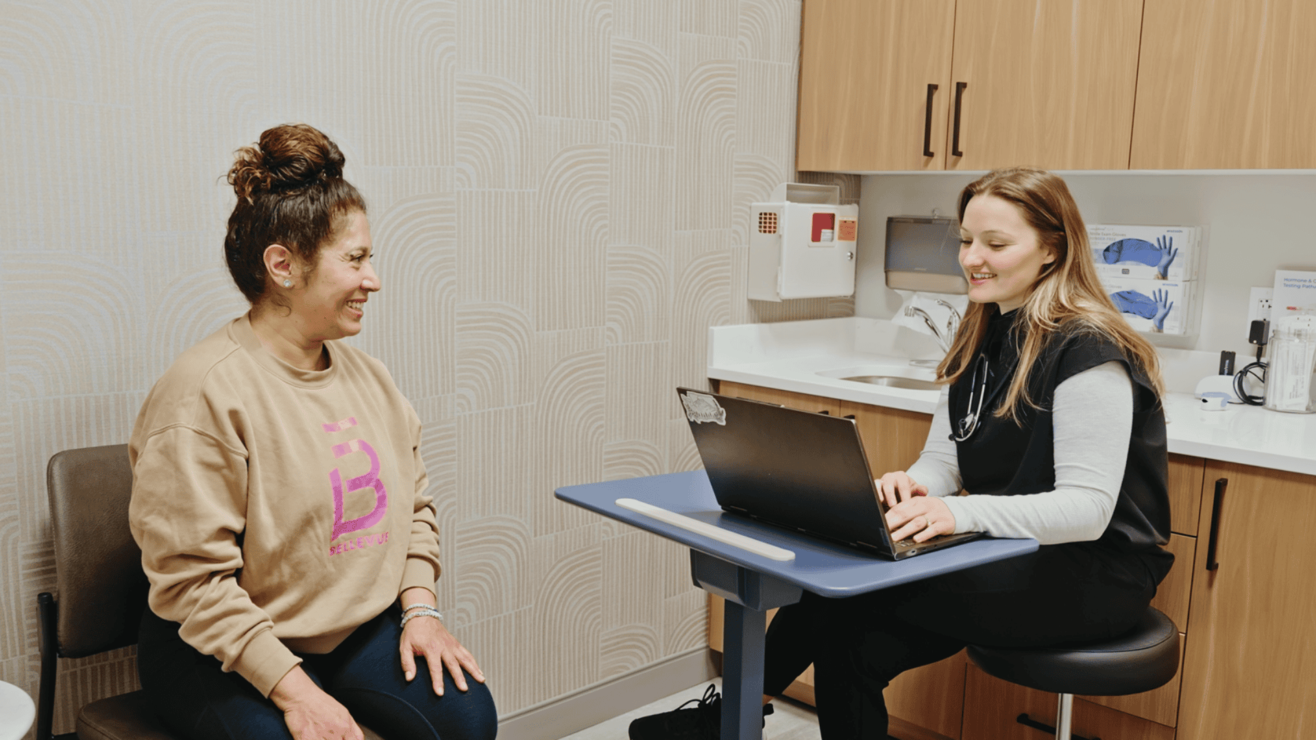 Functional medicine provider at Vida Integrated Health reviewing genetic SNP testing results with a patient during a clinic consultation